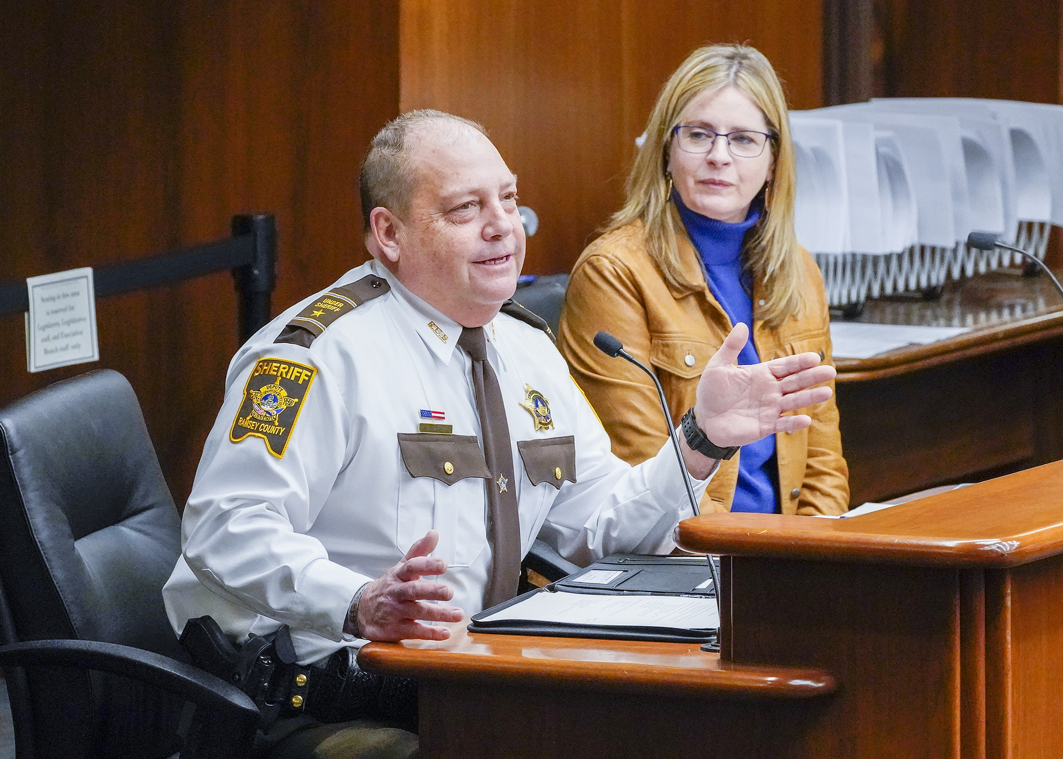 Ramsey County Undersheriff Mike Martin testifies Feb. 2 in support of a bill sponsored by Rep. Kelly Moller, right, that would authorize the expanded use of tracking devices during stolen vehicle investigations. (Photo by Andrew VonBank)